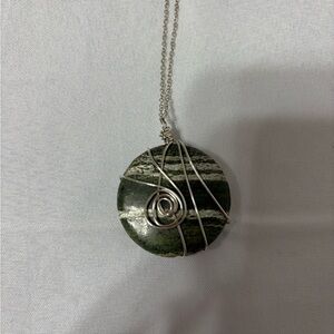silver chain necklace with a round green and white striped Kambaba Jasper stone